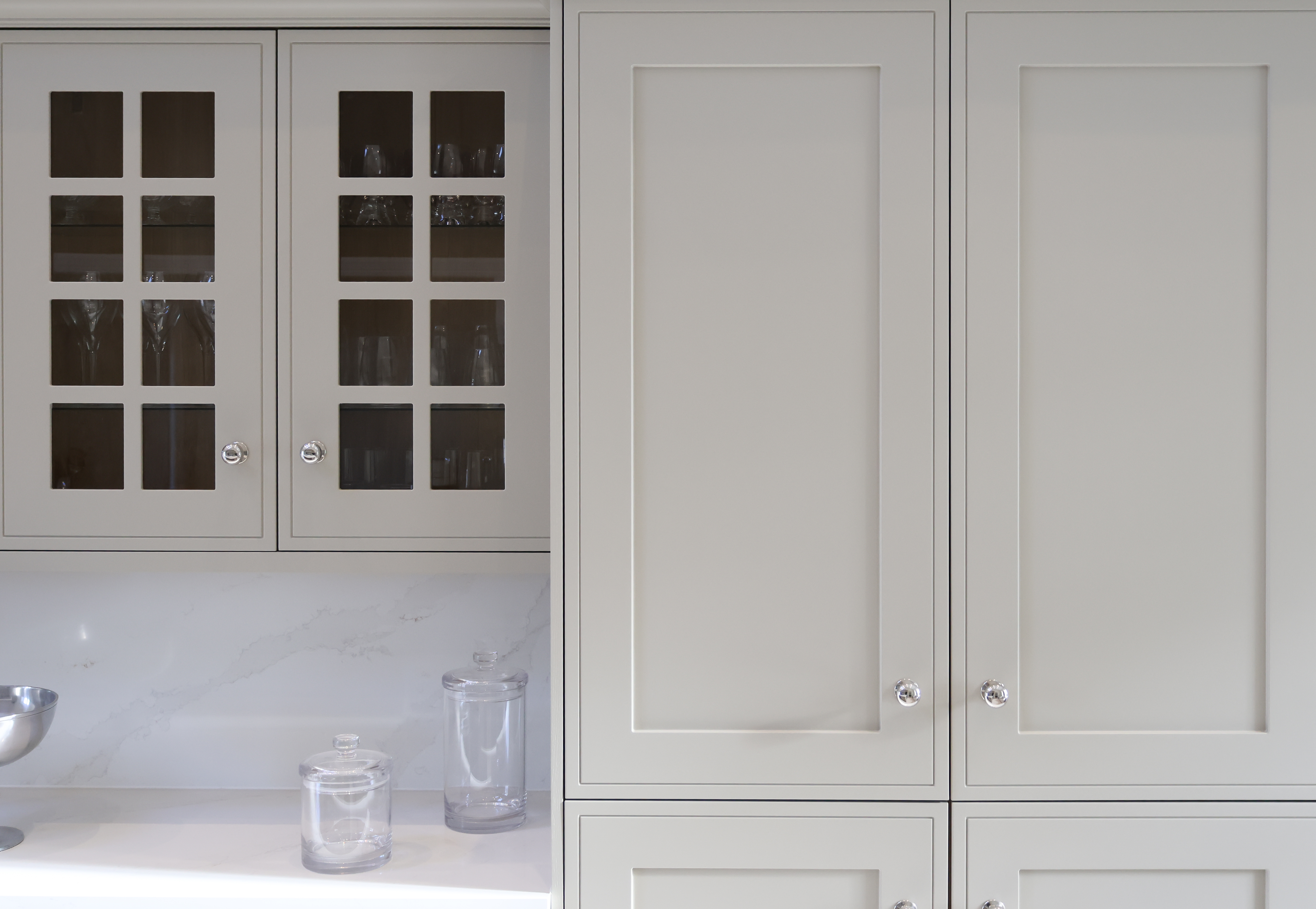 Kitchen cabinets with glass panel doors showing finished result